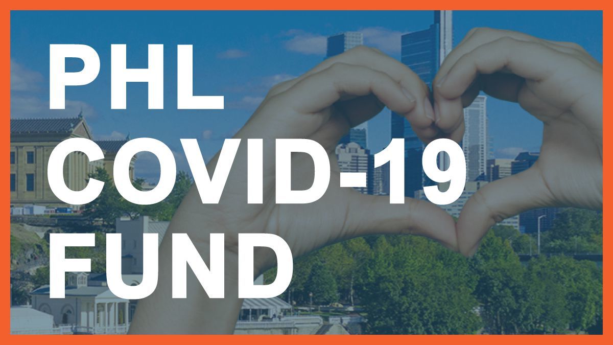A pair of hands forming a heart with the Philadelphia skyline in the background and the words PHL Covid-19 Fund over top
